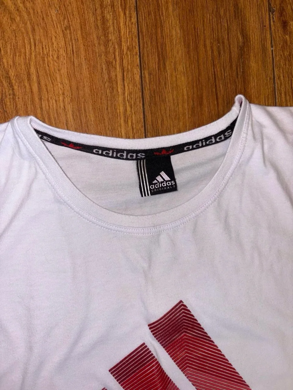Vintage Adidas tee with red logo
